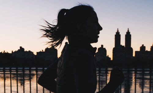 silhouette photo of woman running