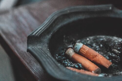 three cigarette butts on ashtray