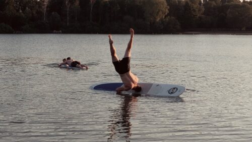 man on surfboard during daytime