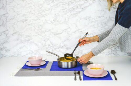 woman serving soup