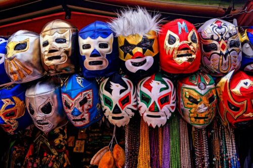 assorted-color of masks hanged on rod