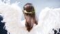 woman wearing white angel wings